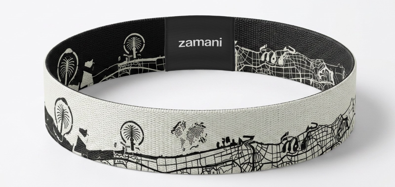 The reversible Dubai it wristband, cream map side out and black map side within, with a woven zamani tag
